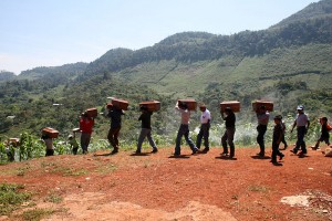 Indigenous Mayans carrying their loved one's remains after an exhumation in the Ixil Triangle, Guatamala. The Ixil people have been the victims of genocide during Guatamala's civil war © Trocaire / CAFCA archive | Flickr