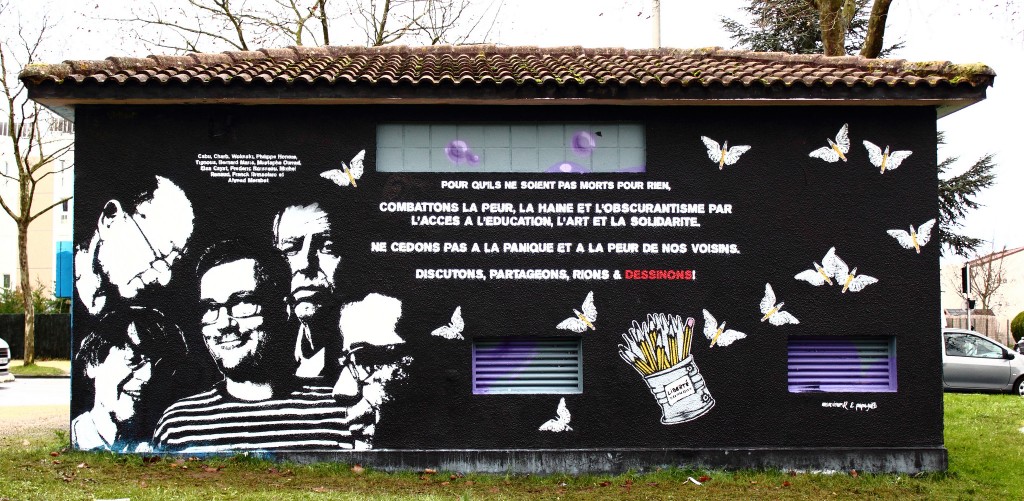 Mural by graffiti artists mr.R and papagibs with Portraits of Charb, Wolinski, Cabu, Tignous and Bernard Maris saying "Fight fear , hatred, and darkness by access to education , art and solidarity. Do not give in to panic and fears of our neighbors. Discuss , share , laugh, and draw! © ID Number THX 1139 | Flickr 