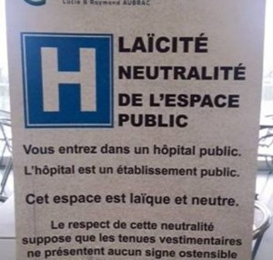 Public notice posted in a French public hospital stating that due to the “laïque and neutral” space of the hospital, anyone wearing an “ostentatious symbol linked to a religion” would be denied entry © Alana Lentin