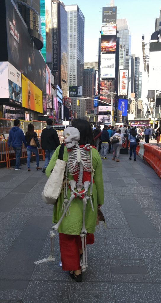 Artivism and the space(s) of democracy: Ashmina with Bipad walking along Times Square © Marina Kaneti