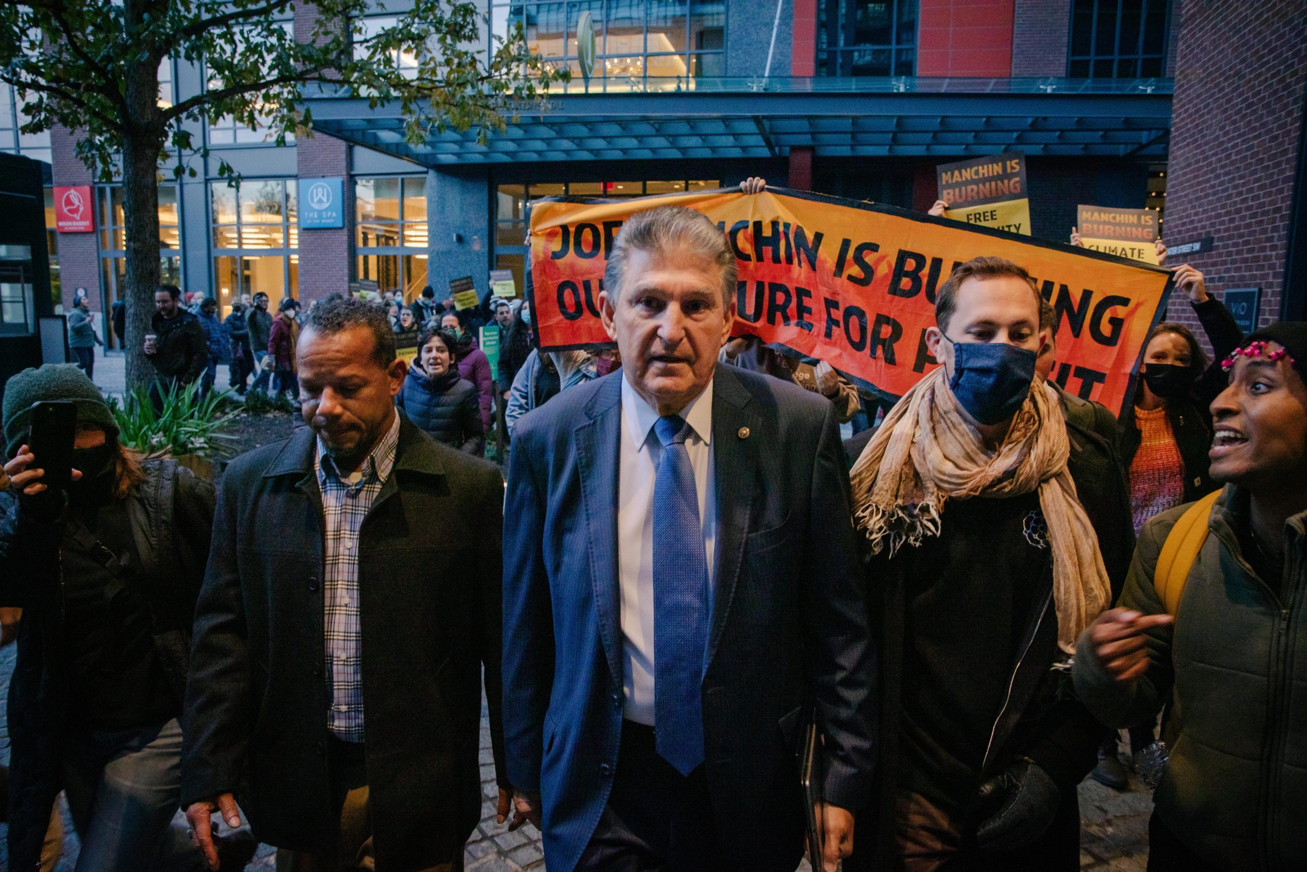 Washington,DC USA - November 4 2021: Senator Joe Manchin is confronted by climate activists leaving his boat on his way to Capitol Hill