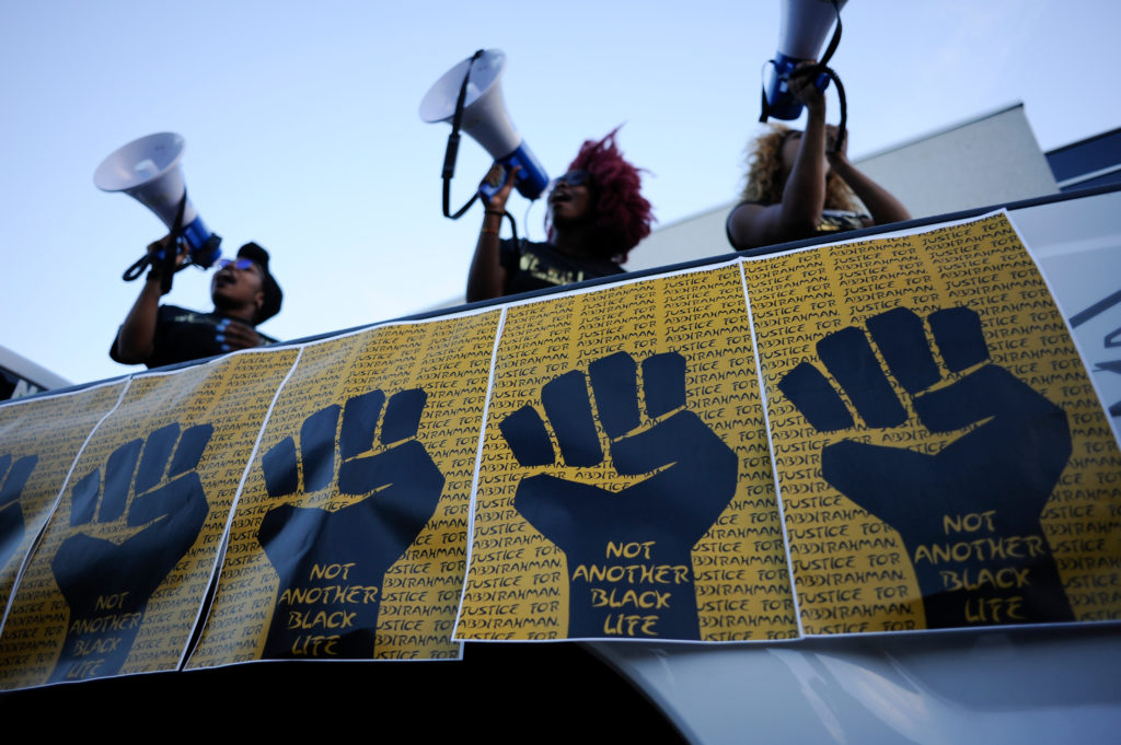 MISSISSAUGA - AUGUST 25: Black lives matter activists speaking while protesting the death of Abdirahman Abdi, who was killed by Ottawa police on August 25 2016 in Mississauga,Canada