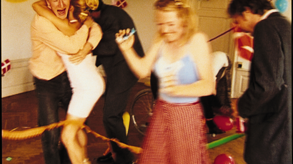 Blurry film still of people at a party, from The-Idiots_ by Lars von Trier