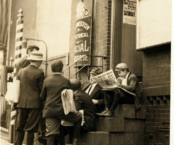 Group of newsboys on a stoop at 4th & Market Sts. "Take our mugs, mister?" Investigator, Edward F. Brown. Location: Wilmington, Delaware. Photograph by Lewis Wickes Hine, May 1910.
