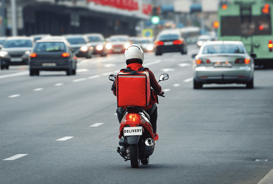 Food delivery driver in traffic