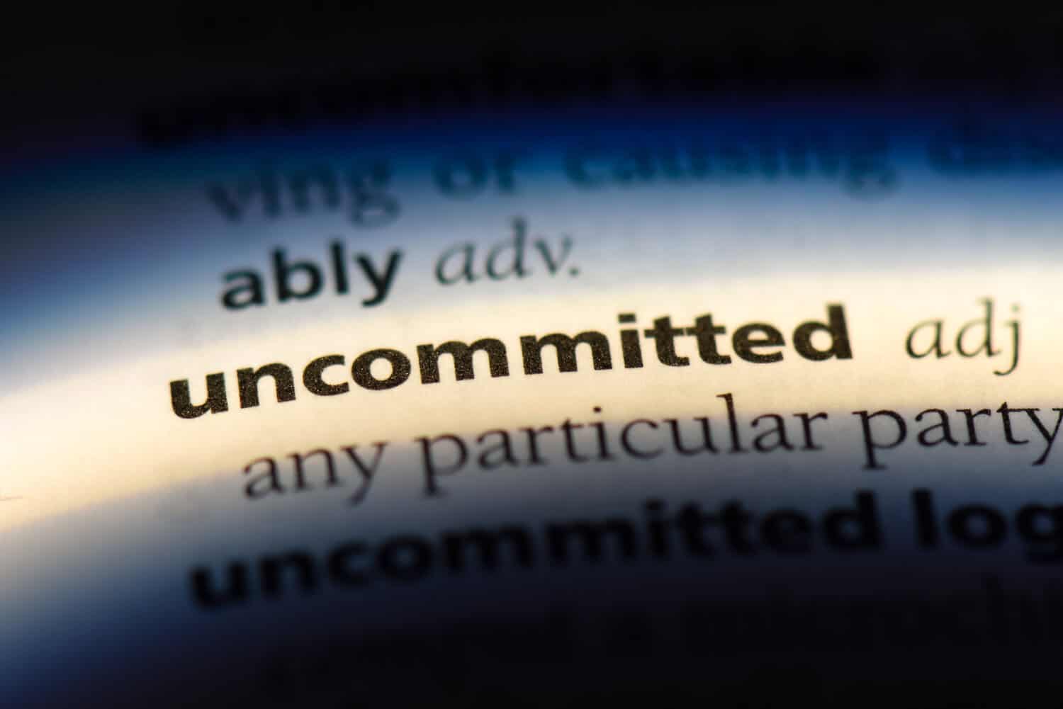 Uncommitted is defined in a lowly-lit dictionary with an emphasis on the words: "any particular party."