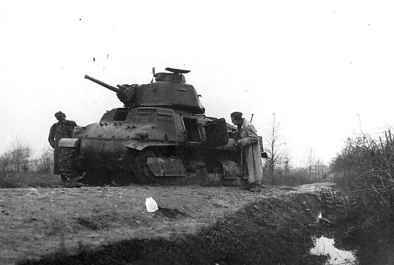 Black and white photo of destroyed german tank in Bosnia with figure