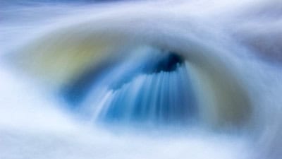 Soft-focus photo of water falling